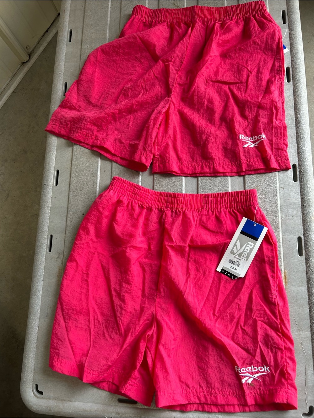 2 pairs nwt Reebok girls shorts. 1 L & 1 xl.  Elastic waist. Side pockets.